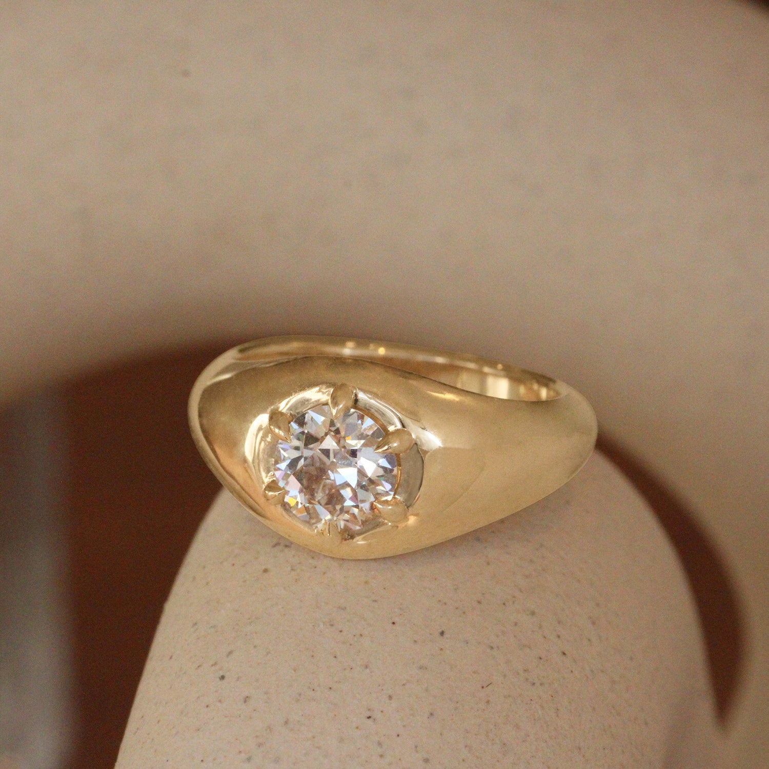 Lifestyle angled side view of Leonard 6 Ring Old Euro Natural Diamond 1.04ct by Goldpoint Jewelry on a ceramic with a blurred background