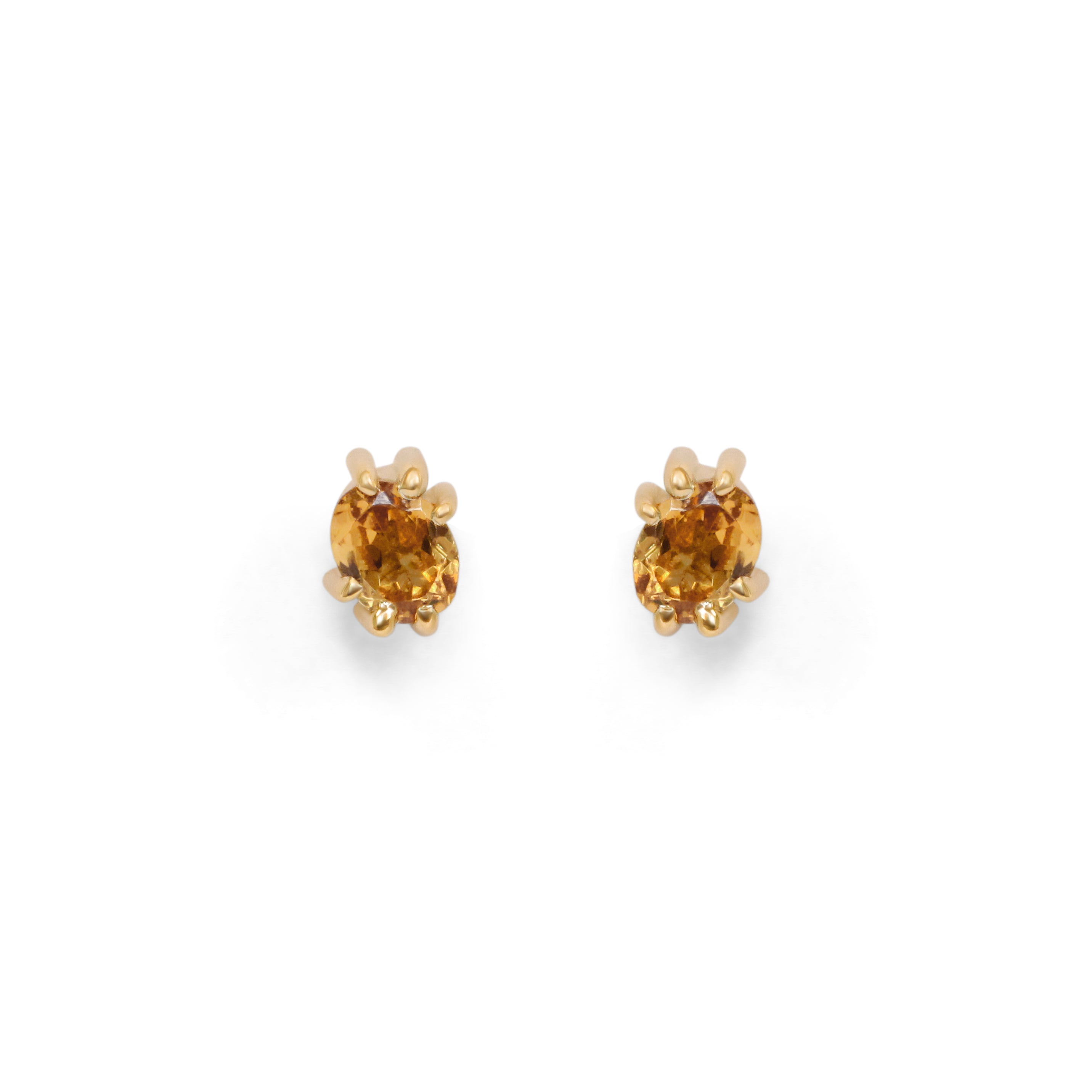 Front view of a set of Miro Earring / Oval Orange Spessartite Garnet pieces by Goldpoint Jewelry