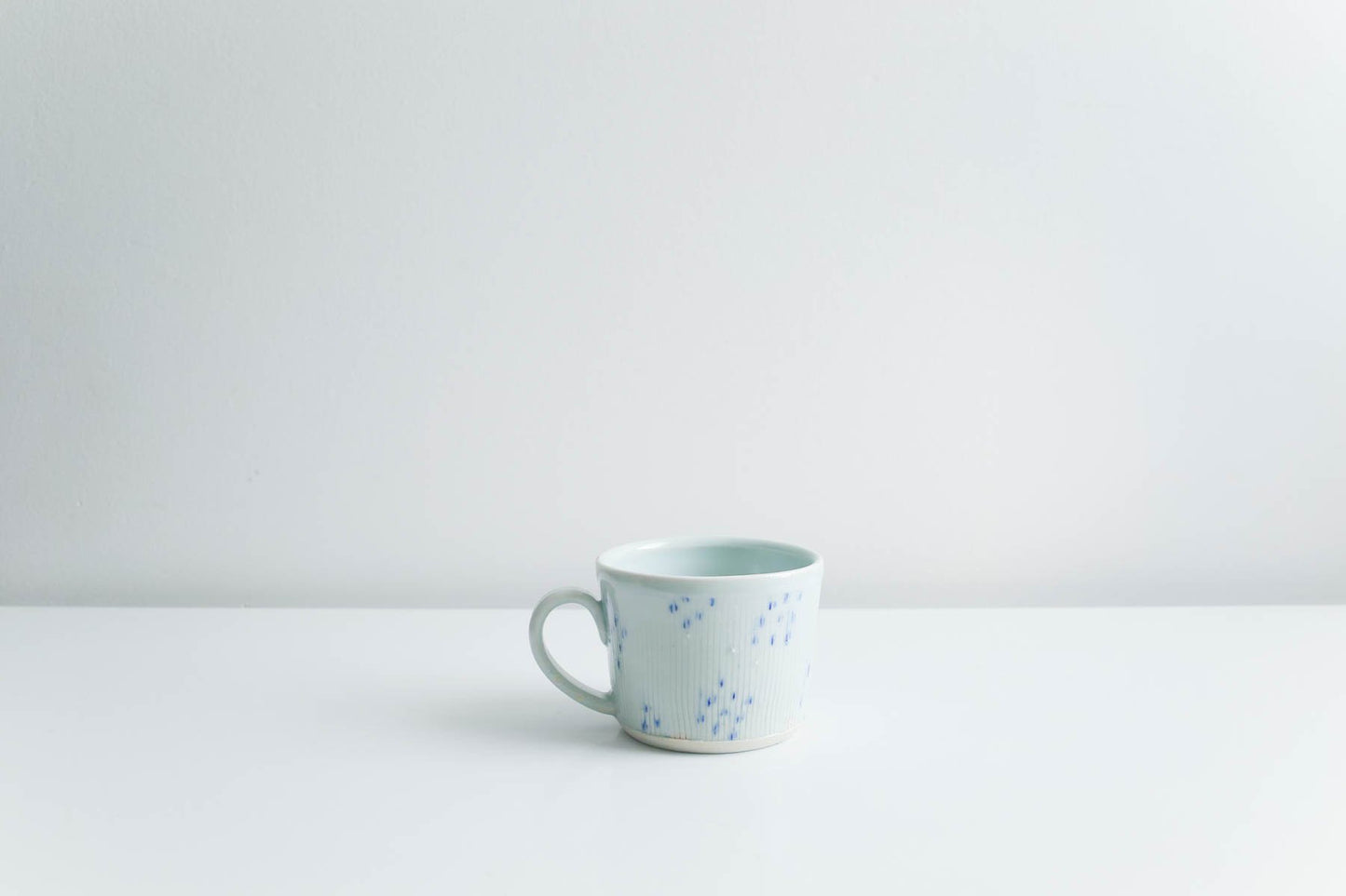 Mug with Blue Dots in Glossy Celadon by Goldpoint