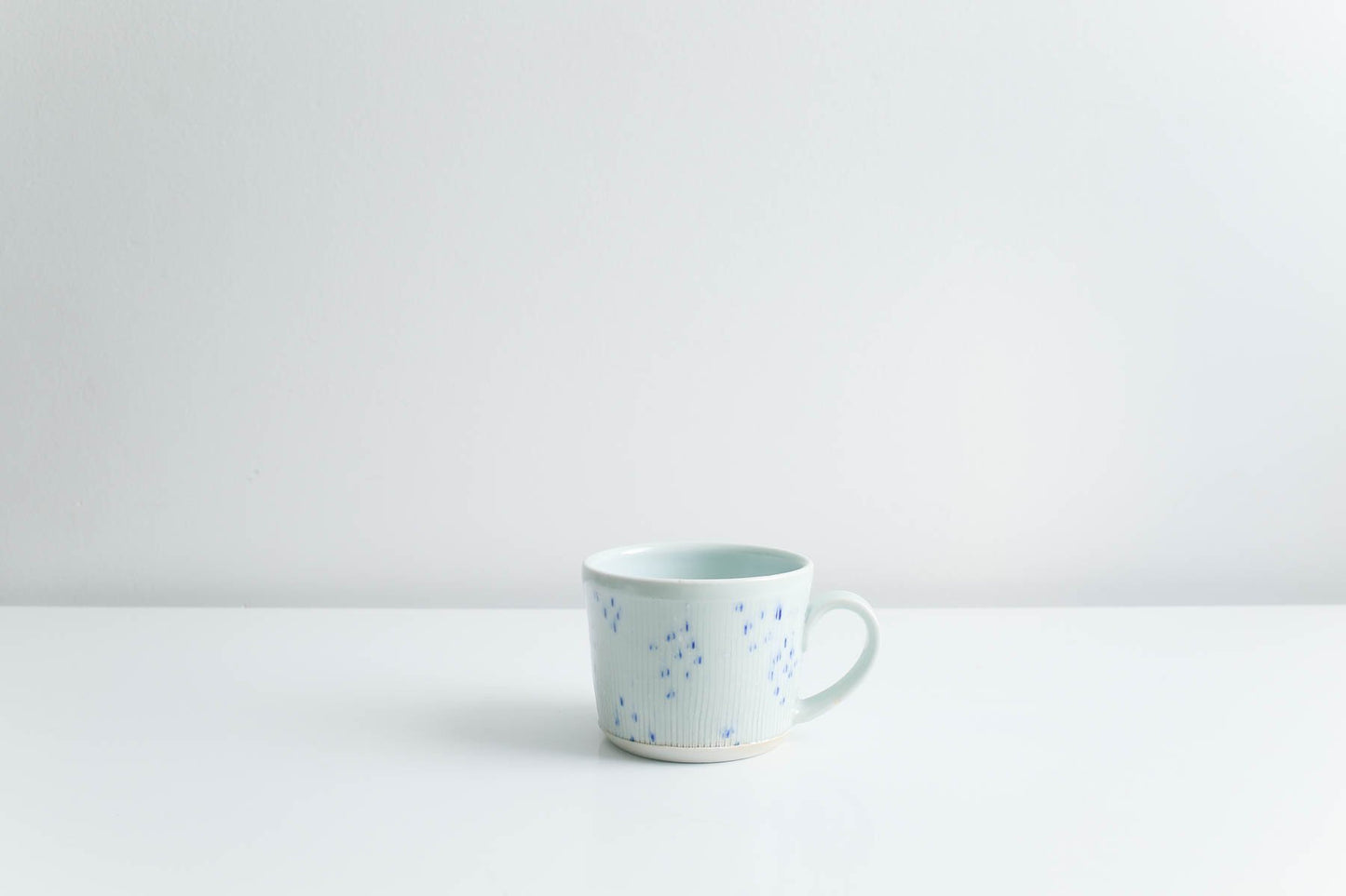 Mug with Blue Dots in Glossy Celadon by Goldpoint