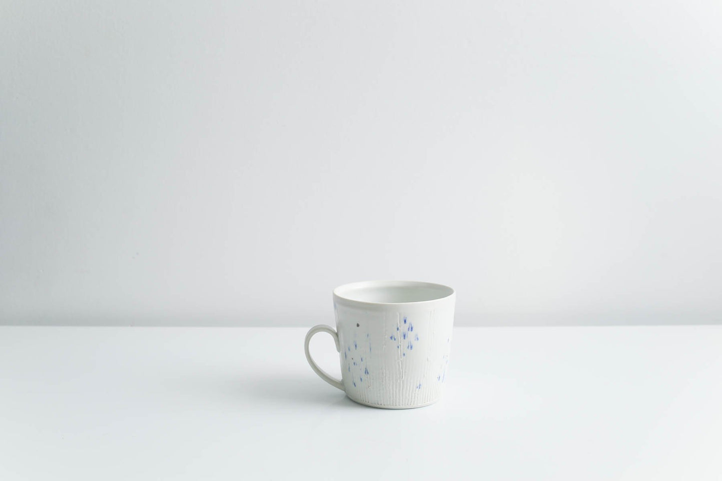 Mug with Blue Dots in Matte White by Goldpoint