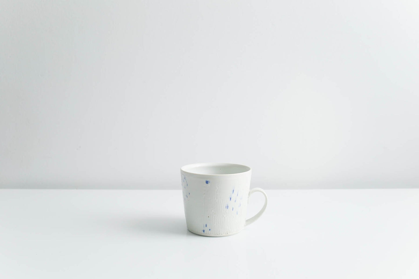 Mug with Blue Dots in Matte White by Goldpoint