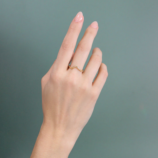 Model wearing Peak Band / Knife Edge Angled on middle finger