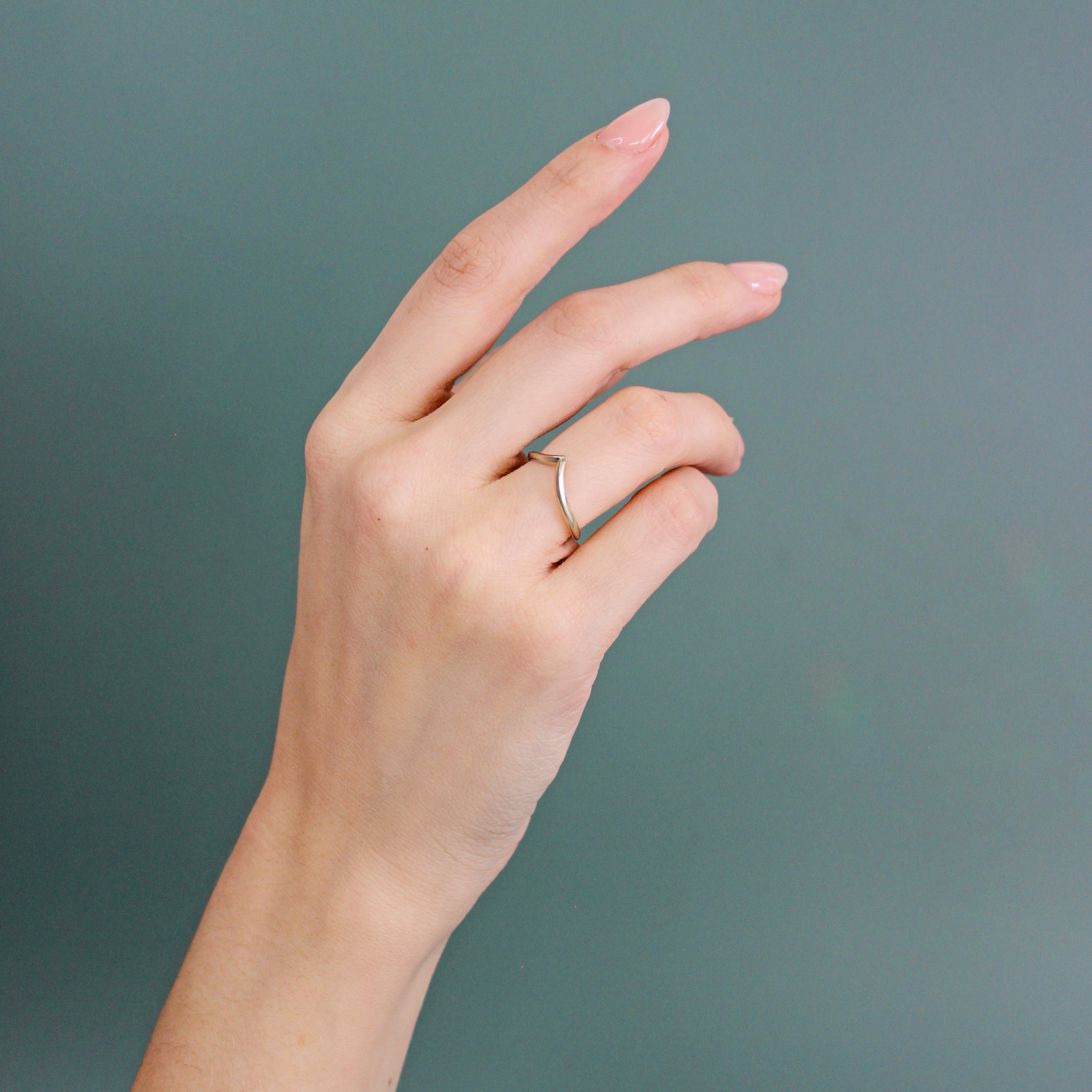 Model wears Peak Knife Edge Band in 14k yellow gold
