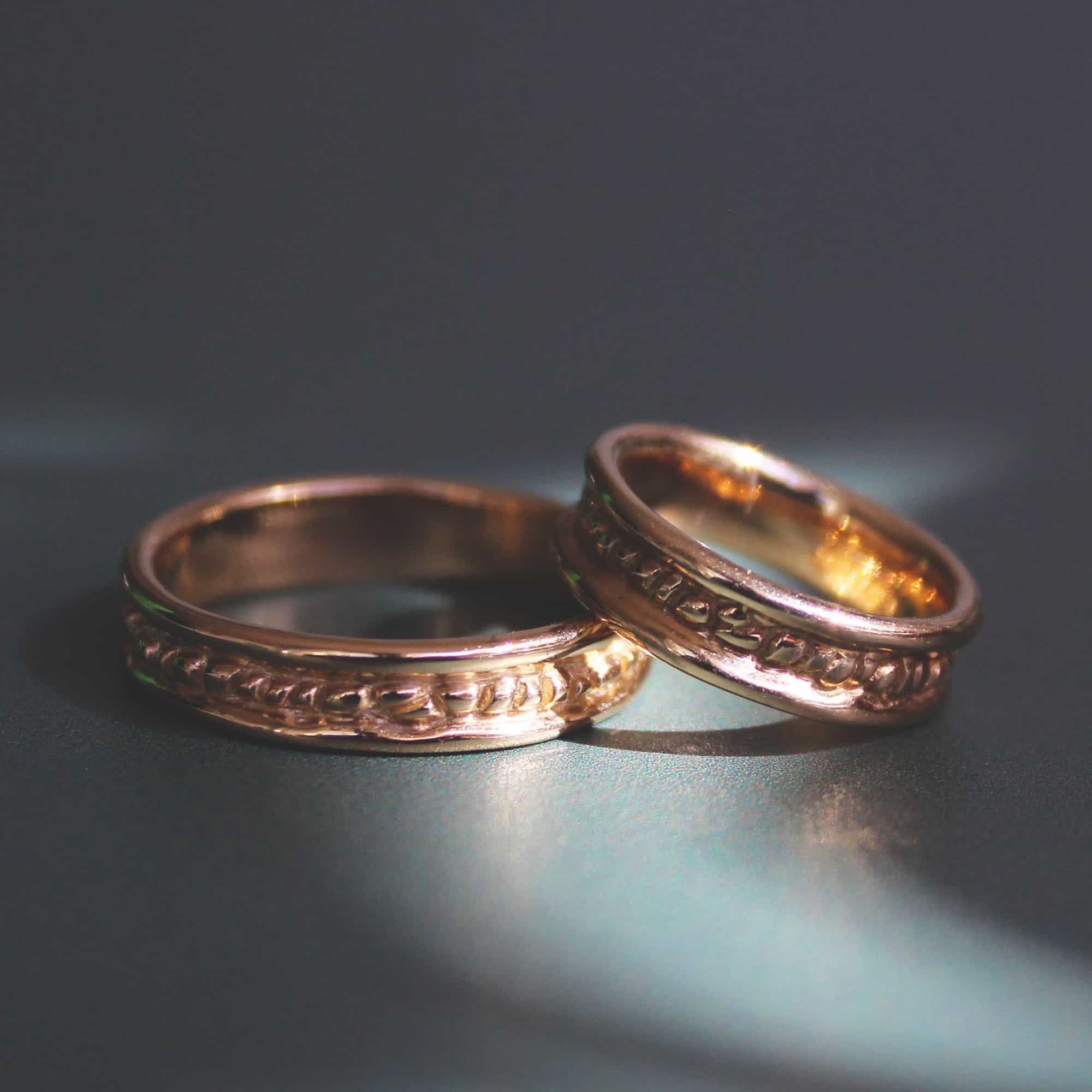 Lifestyle stacked pair of two Ruins Band Polished Sides in 14k yellow gold rings