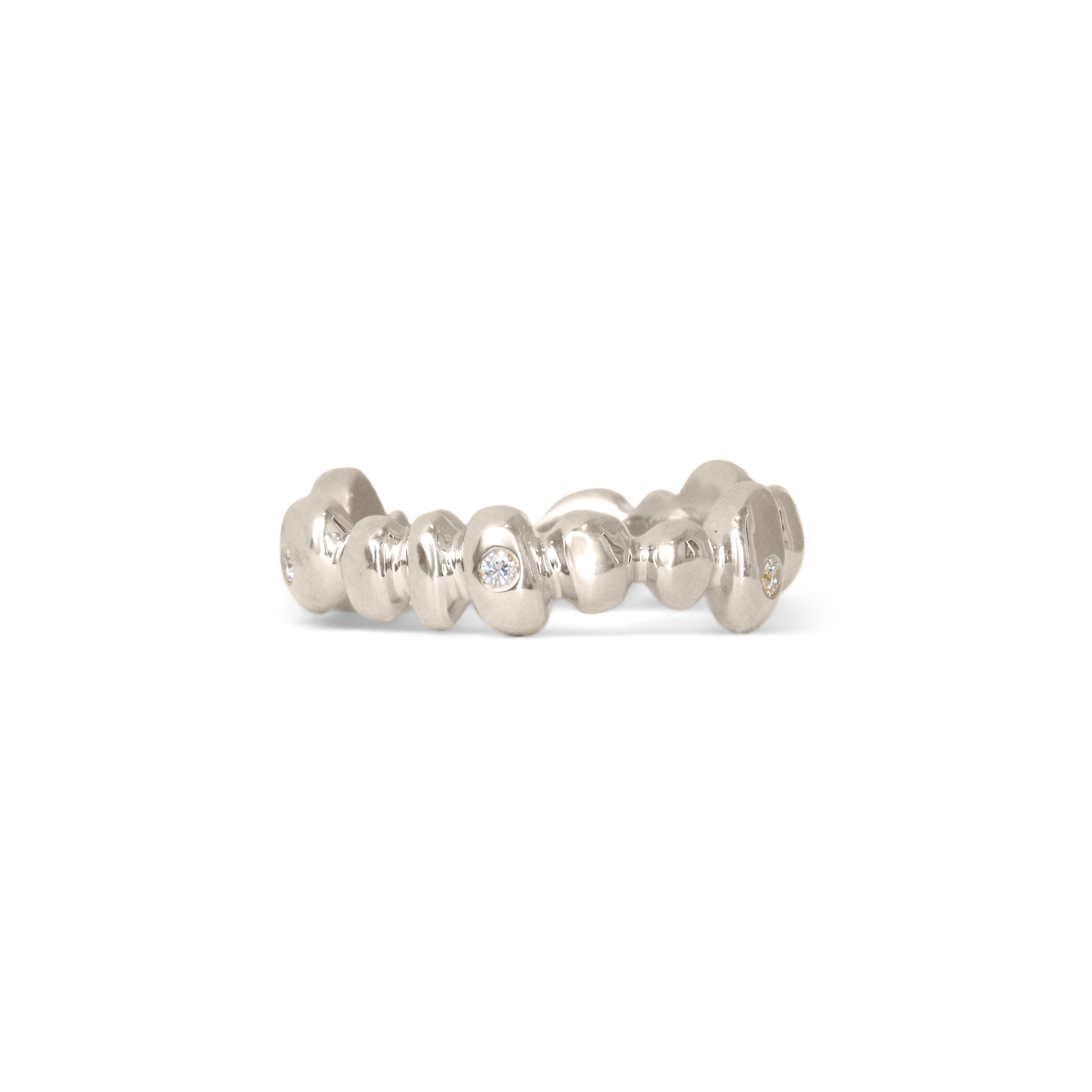 Front view of Ruins Band Medium Flush Round Lab Diamonds in 18k White Gold by Goldpoint Jewelry