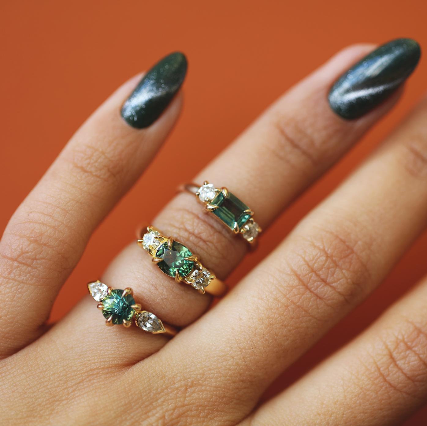 Model wears Wythe Ring Round Sapphire 1.5ct with other engagement rings by Goldpoint