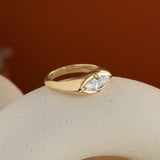 Lifestyle side profile view of Leonard 4 Ring Marquise Diamond 1.02ct by Goldpoint Jewelry on a ceramic with a orange background