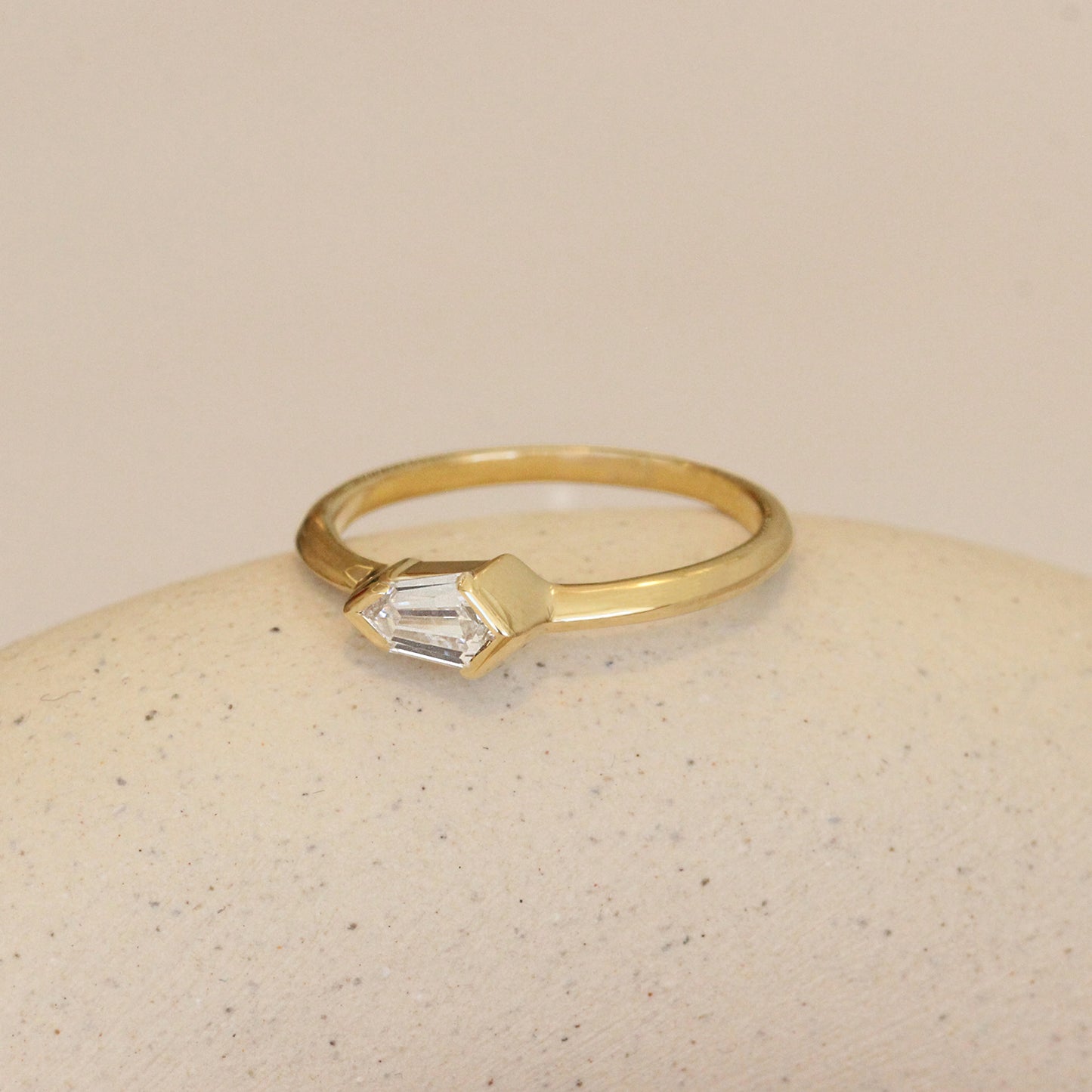 Lifestyle shot of side angled view of Sideways Ring / Shield Diamond
