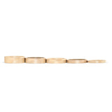 Stacked view of Flat Bands lined up together in various widths in 14k yelow gold