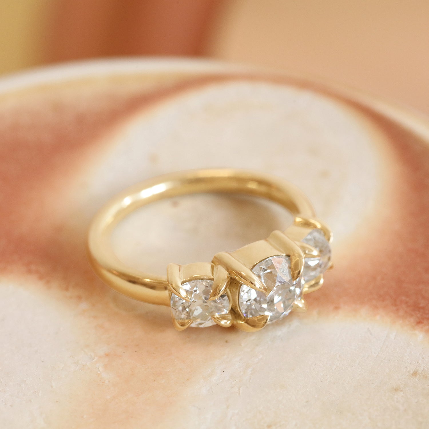 Lifestyle side view of Sutton 3 Ring Old Euro Diamond 1.11ct by Goldpoint Jewelry on a ceramic