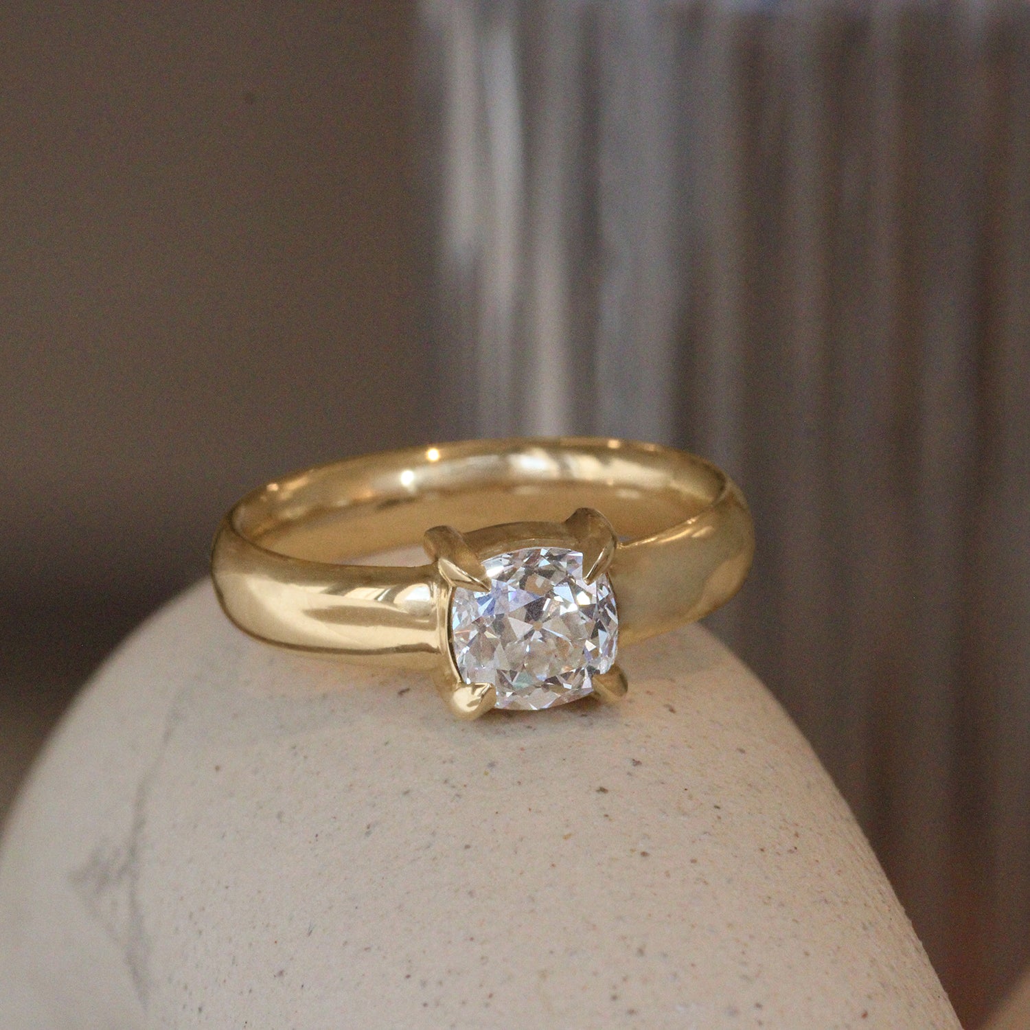 Lifestyle angled view of Sutton Ring Old Mine Natural Diamond 1.32ct by Goldpoint Jewelry on a ceramic with a blurred background