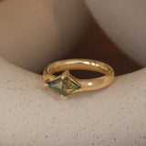 Lifestyle angled view of Sutton Ring / Rose Cut Kite Sapphire 1.09ct by Goldpoint Jewelry on a ceramic with a blurred background