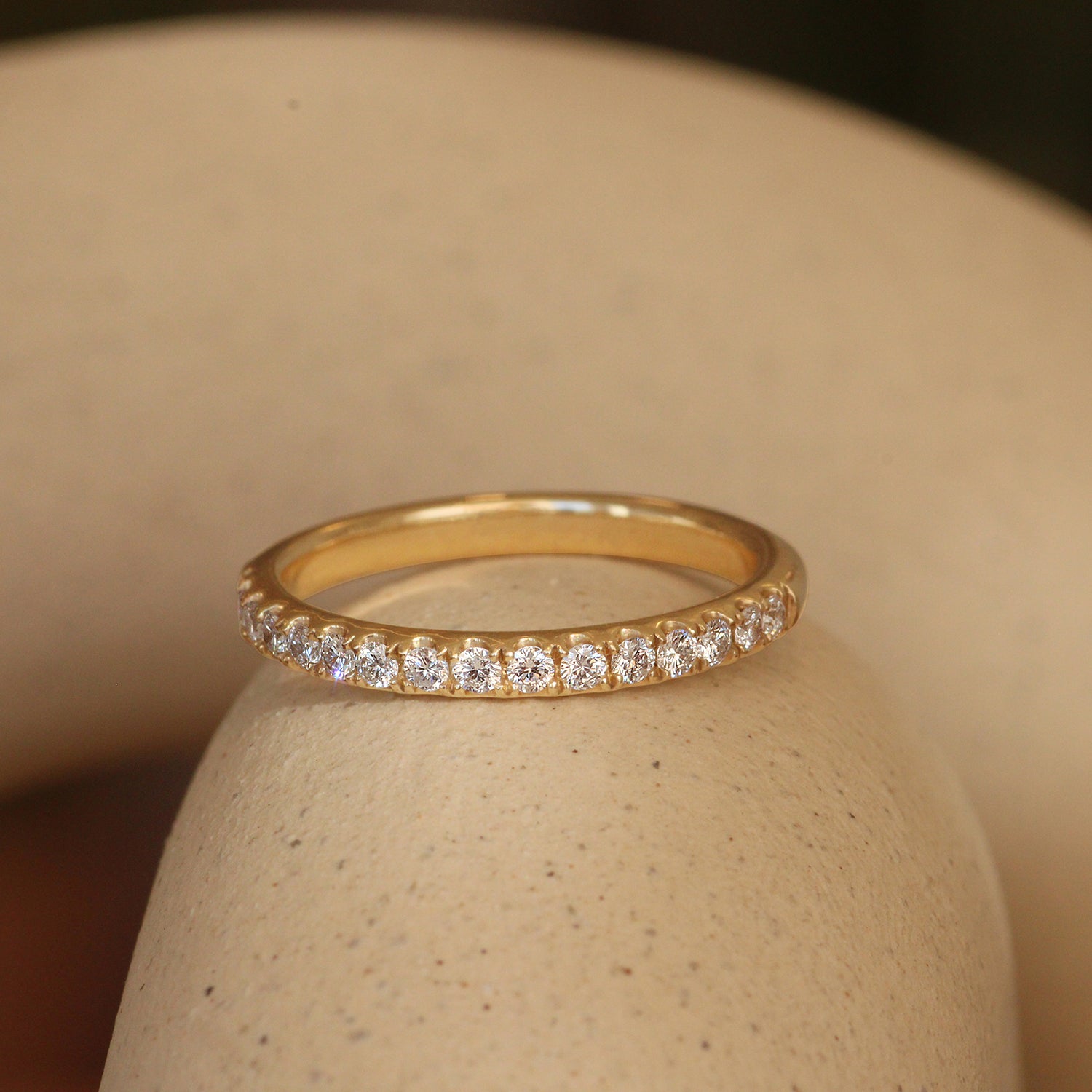 Lifestyle angled view of Thick Dome Band 2mm Pave Round Diamonds in 14k yellow gold
