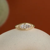 Lifestyle front view of Leonard 4 Ring Marquise Diamond 1.02ct by Goldpoint Jewelry on a ceramic with a orange background