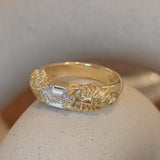 Lifestyle angled side view of Twin Scorpion Ring / Elongated Hexagon Lab Diamond 1.10ct by Amour Vee on a ceramic with a blurred background