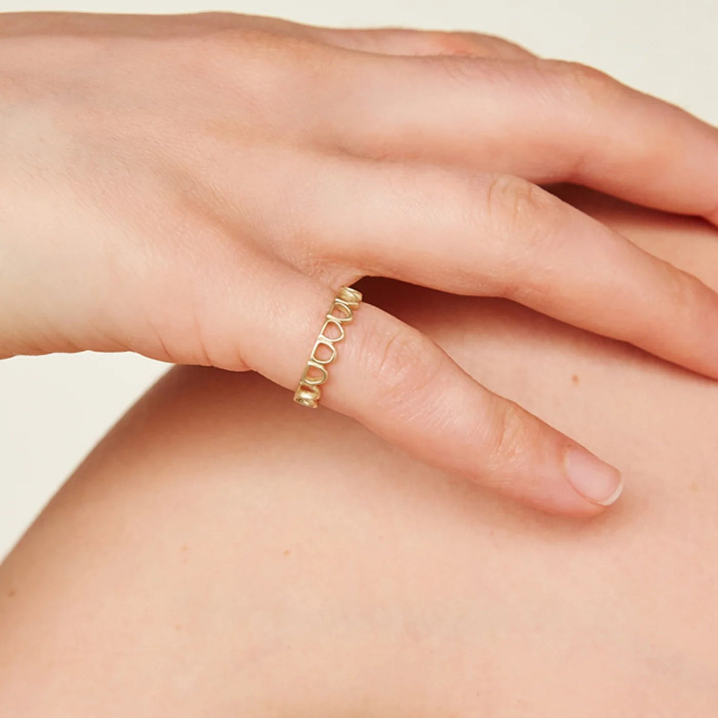 Model wears Arco Ring by Mon Pilar on pinky finger