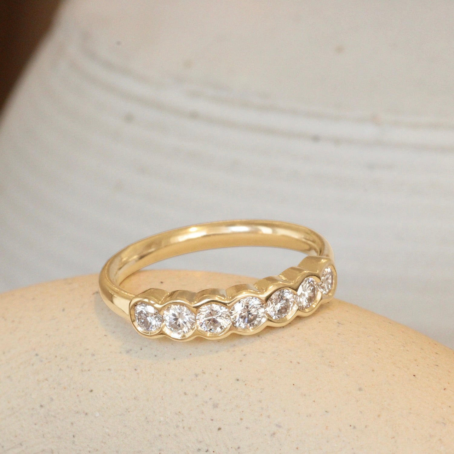Lifestyle angled view of Cloud 7 Band Round White Diamonds in 14k yellow gold