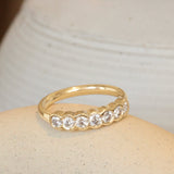 Lifestyle angled view of Cloud 7 Band Round White Diamonds in 14k yellow gold