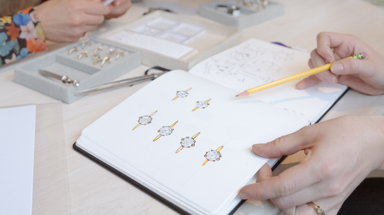 Sketch process of our team working with a client to showcase different custom options available for a custom engagement ring being designed at our studio.