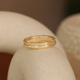 Lifestyle angled view of Duo Band in 14k yellow gold