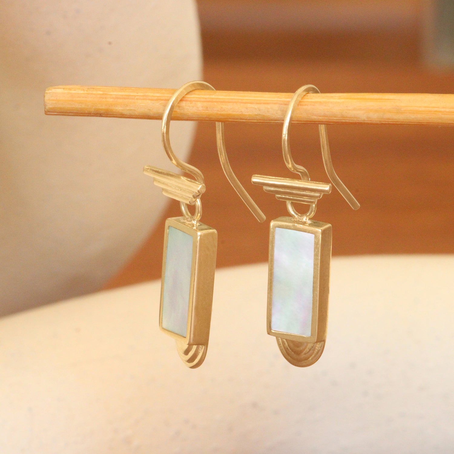 Lifestyle angled view of Step S Hook Earrings / Rectangle White Mother of Pearl Inlay by Goldpoint Jewelry
