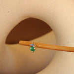 Lifestyle angled view of Points Earring / Emerald + Lavender Sapphire by Goldpoint Jewelry