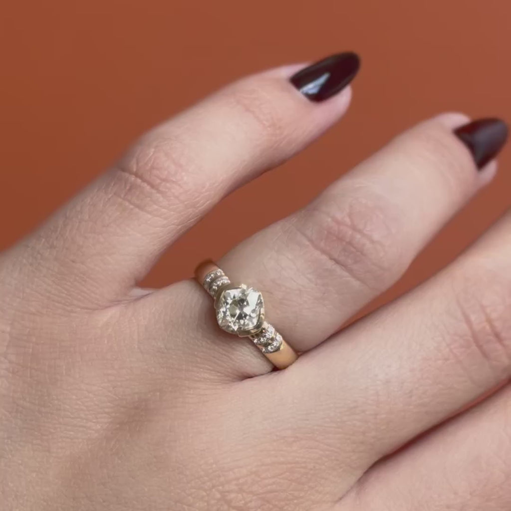 Model wears Dobbin Ring Old Mine Natural Diamond 1.44ct by Goldpoint Jewelry on ring finger while showing different angles over an orange backdrop