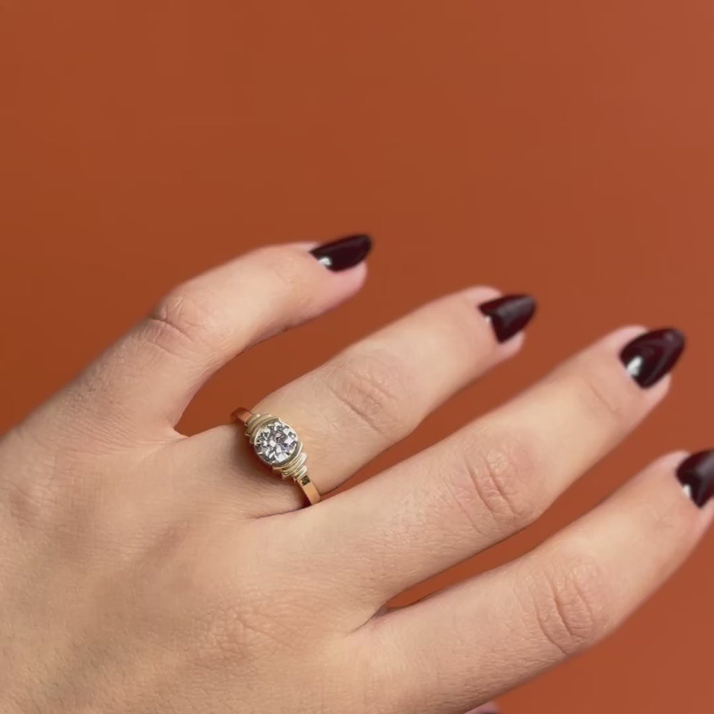 Model wears Kent Ring Old Euro Diamond 1.08ct by Goldpoint Jewelry on ring finger showing different angles over an orange backdrop