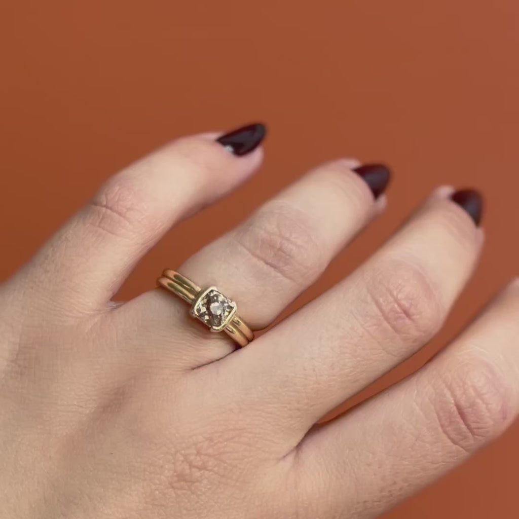 Model wears the Franklin Ring Old Mine Natural Diamond 1.2ct by Goldpoint Jewelry on the ring finger while showing different views over an orange backdrop