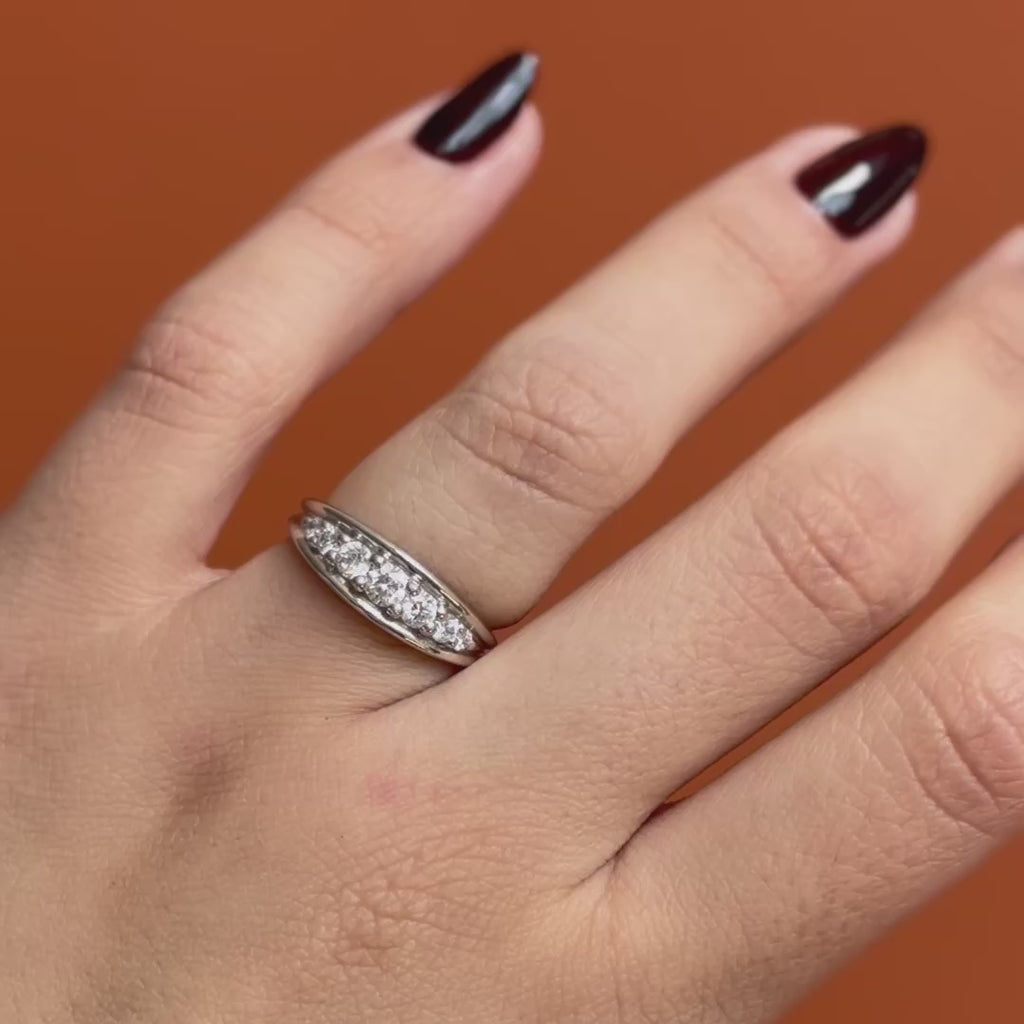 Model wears Humboldt Ring Round Lab Diamond 0.17ct by Goldpoint Jewelry on ring finger showing different angles over an orange backdrop