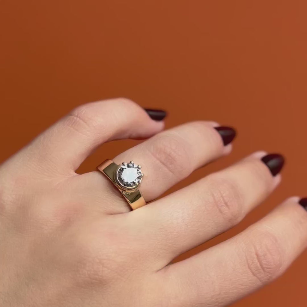 Model wears Varick Ring / Round Grey Lab Diamond 1.82ct by Goldpoint Jewelry on ring finger showing different angles over an orange backdrop