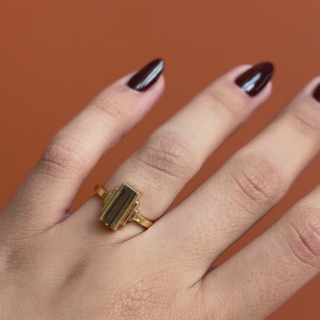 Model wears Kent Ring Baguette Sapphire 1.45ct by Goldpoint Jewelry on ring finger showing different angles on an orange backdrop