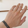 Model wearing Horus Band / 3 Marquise Diamonds on pinky finger showing different angles of band