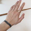 Model showing different angles of Step Flat Band / Matte, Polished Sides on index finger