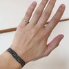 Model showcasing different angles of Thick Dome Band / Rose Cut Diamonds on pinky ring