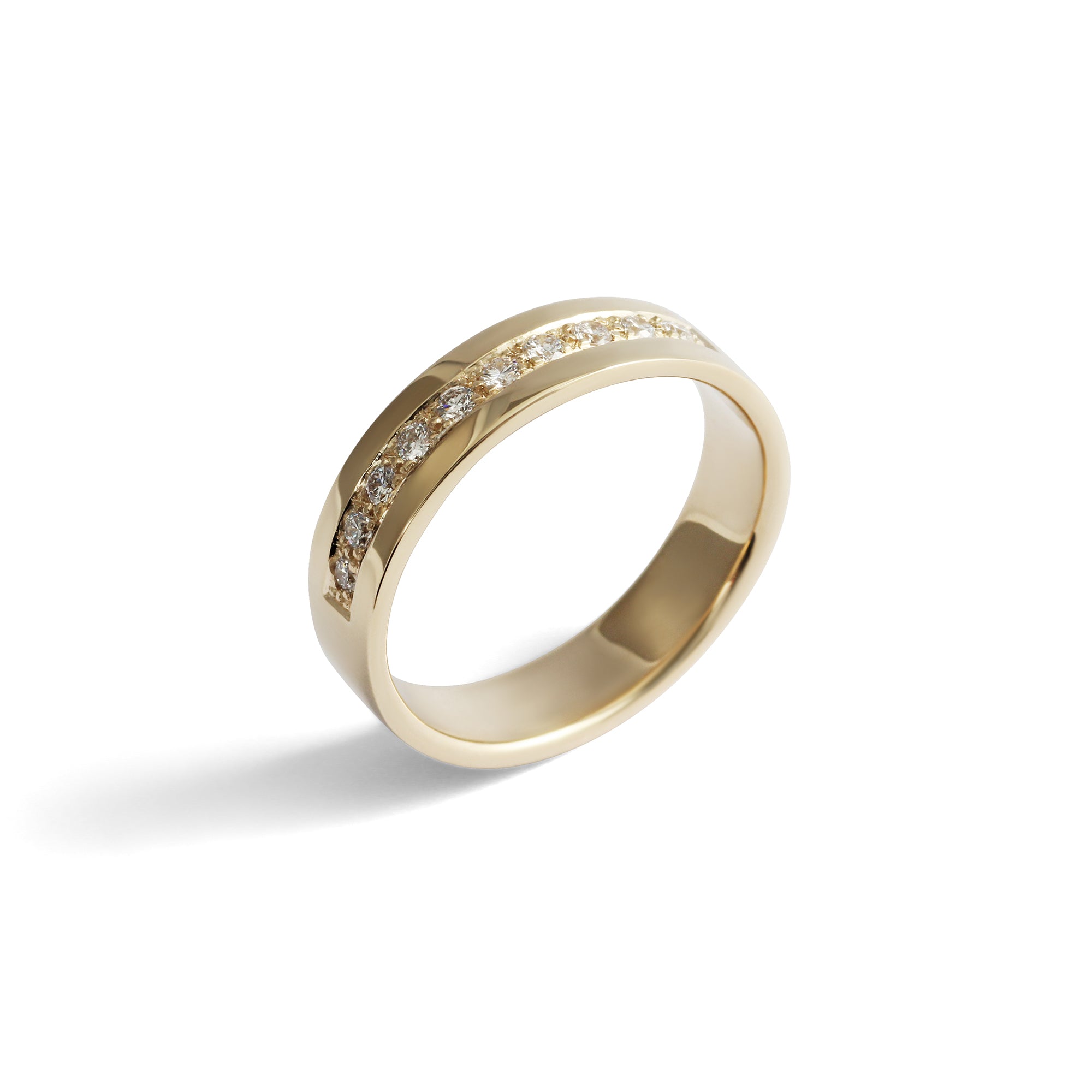 Angled view of Flat Band 4mm Bright Cut Lab Diamonds in 14k yellow gold