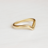 Lifestyle side view of Peak Band Dome in 14k yellow gold