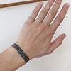 Model showing different angles while wearing Cornice Band / Lab Melee Diamonds on pinky finger